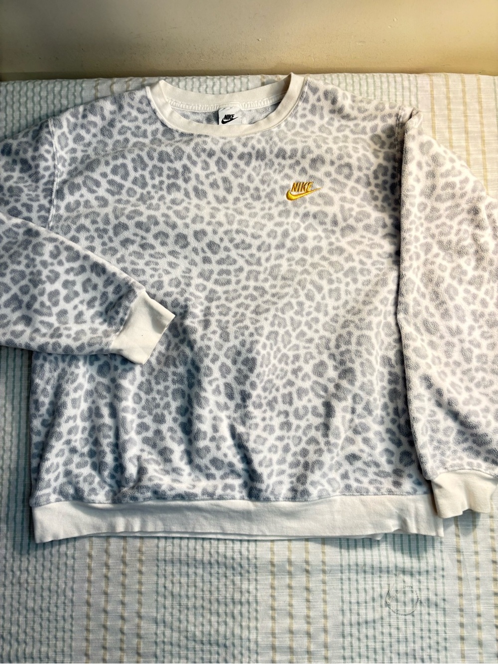 Nike White Crew Sweatshirt with Light Gray Leopard Print and Gold Swoosh